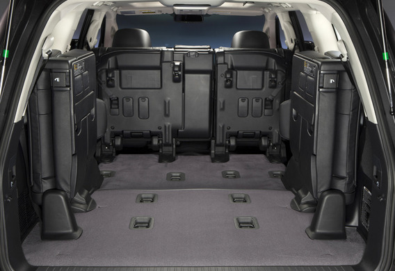 How do I fold the third row of seats in the Toyota Land Cruiser 200?